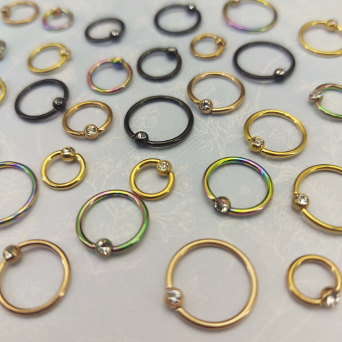 Кольцо 1,2 мм. Титан. Шарик с кристаллом, золотое анодирование. BCRTCA16g