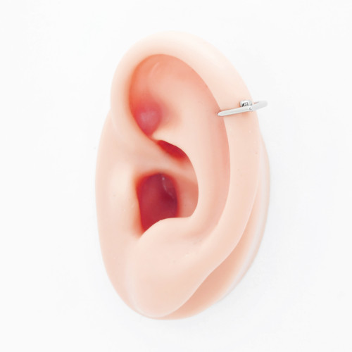 Кольцо-капля сегментное 1,2 мм кликер с кристаллами. Титан, золотое анодирование. HSEGTAJ023